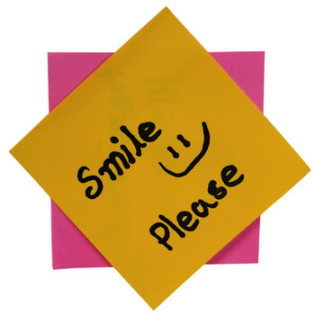 Smiley face sticker with please note on yellow background