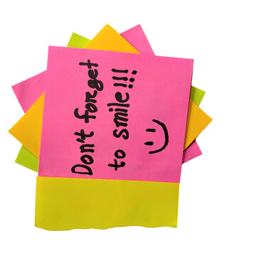 Bright sticky note with smiley face and question mark