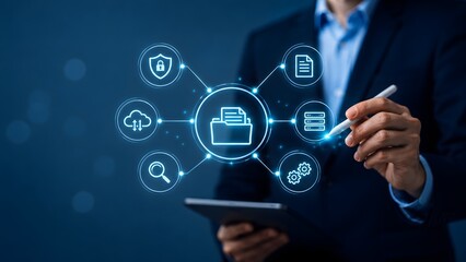 Fototapeta premium Professional using tablet and stylus with glowing folder interface representing secure cloud storage digital archiving and data management system concept