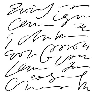 A person writes cursive letter on paper with a pen.