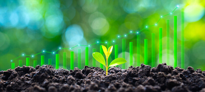 The concept of green growth and sustainable innovation, with seedlings growing against a digital circuit board background and a graph showing the increasing financial growth of clean technologies.