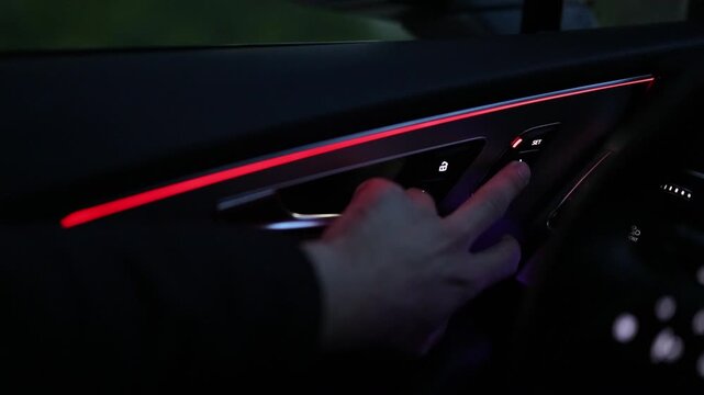 Control buttons for settings and memory of the driver's seat, electric glass opening, door handle in the interior of the new luxury electric car. Driver's seat adjustment buttons