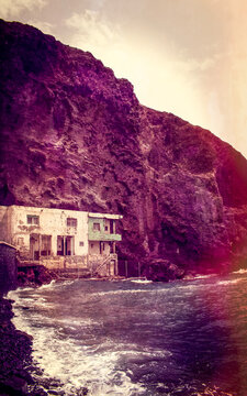 Tenerife, Canary Islands, Spain: a dilapidated house on the pebble and black-sand beach of Playa de Los Roques in Los Roques de Fasnia coastal village 