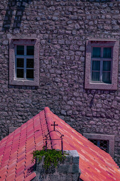 Dubrovnik, Croatia, Europe: windows of a stone building and detail of the roof of The Church of St. Margaret (Crkva sv. Margarita), historic, single-nave Renaissance building in the Old Town 
