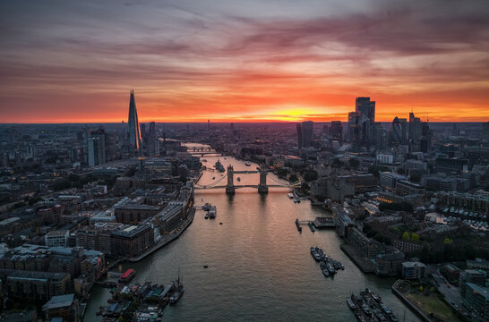 Panoramic, aerial summer sunset view of the skyline of London, England, with Tower Bridge and the City skyscrapers