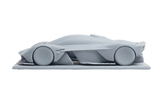 Grey futuristic sports car miniature prototype model isolated