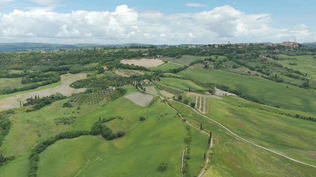 Drone aerial view of Pienza and rolling countryside landscape in Val d'Orcia Tuscany Italy