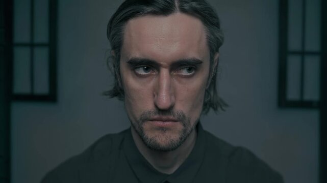 A beautiful yakuza serious strict man with long gray hair and medium beard showing concentration and confidence in a Japanese setting with a focused camera perspective