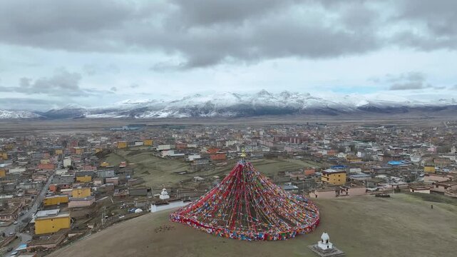 Tibetan Prayer Flags on Hill Above Mountain Town