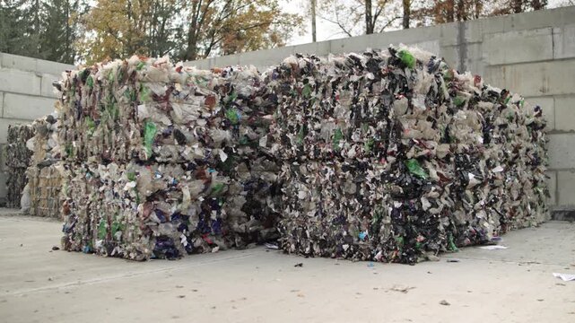 Pressed plastic bottles. Environment. Industry. Landfill of pressed plastic bottles and their recycling. Ecology. Recycling of secondary raw materials.