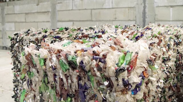 Pressed plastic bottles. Environment. Industry. Landfill of pressed plastic bottles and their recycling. Ecology. Recycling of secondary raw materials.