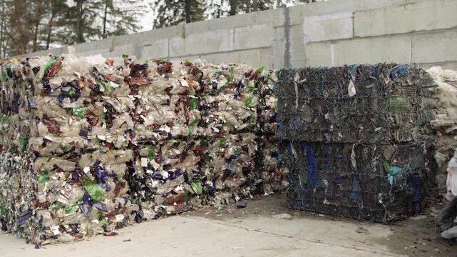 Pressed plastic bottles. Environment. Industry. Landfill of pressed plastic bottles and their recycling. Ecology. Recycling of secondary raw materials.