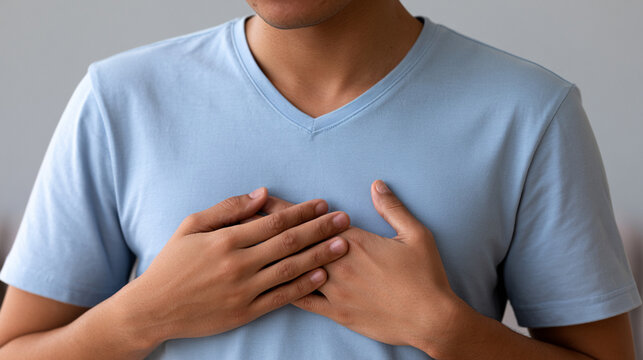 Close up of Young Man with Rapid Breathing Touching Chest in Panic