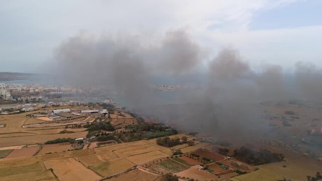In Malta, drone footage shows smoke from the Magħtab landfill fire covering the nearby coastal towns of Qawra, Buġibba and St Paul&rsquo;s Bay along the Mediterranean coast on May 6th, 2026.