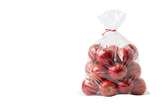 Fresh red apples in transparent plastic bag