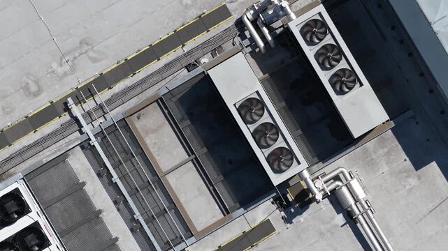 erial view of large scale data center rooftop HVAC cooling systems, showing colocation infrastructure, cloud computing, big data, machine learning and AI hardware technology.
