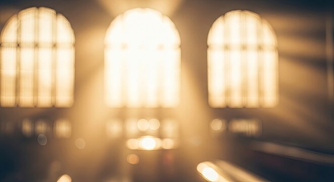 Sunlight streaming through three arched windows creating a mystical and ethereal atmosphere.