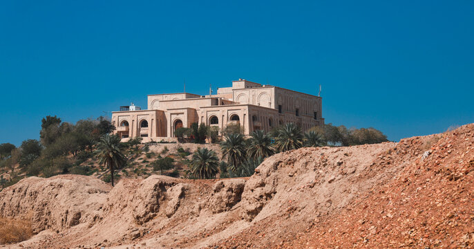 Views of Saddam Hussein Palace in Iraq with clear blue sky and surrounding landscape