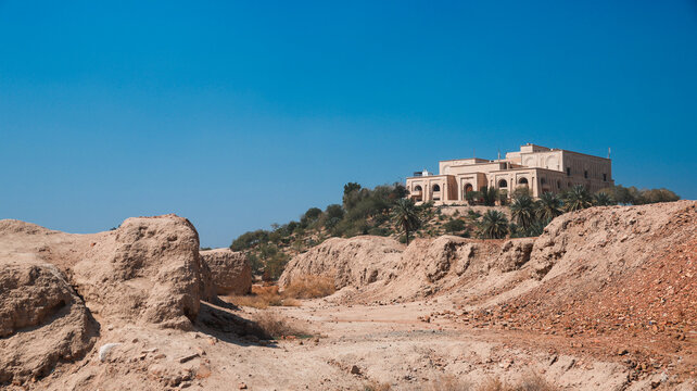 Exploring the historic Saddam Hussein Palace in Iraq amidst the arid landscape