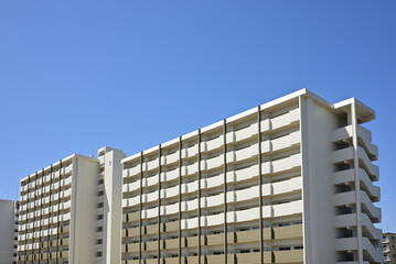 Fototapeta premium Modern apartment building under the blue sky.（団地）3