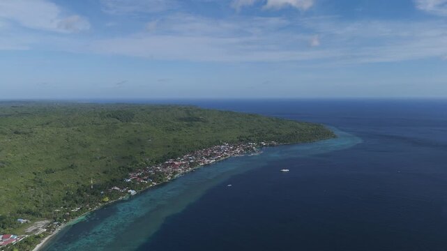 Stilted homes of the Bajau Laut rise gently above turquoise waters, where sea nomads have lived in harmony with the ocean for generations