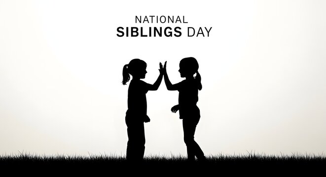 Silhouette of two sisters giving a high five on national siblings day