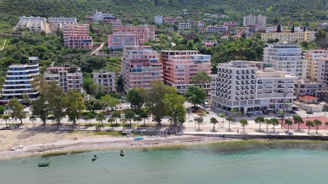 Aerial view of Vlora coastline, waterfront promenade and turquoise Ionian sea