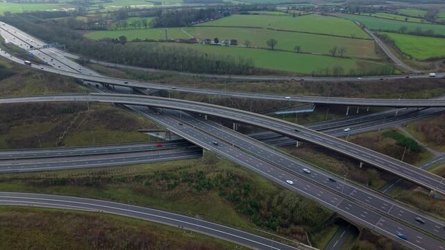 Drone view of the M1 and M6 motorway interchange with complex flyover bridges.