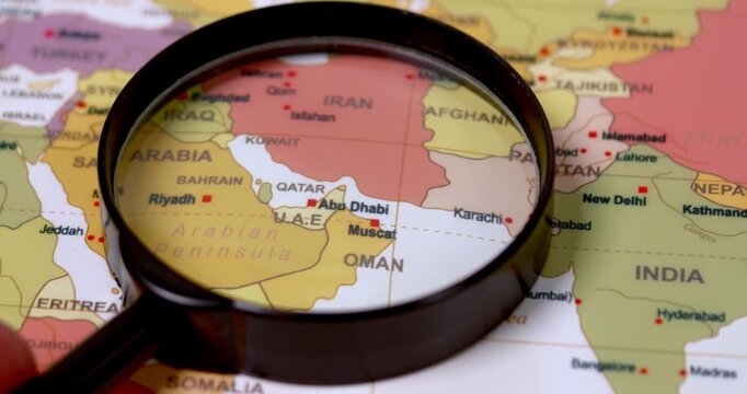 A focused examination of Middle East map highlights geographical features and regional borders.