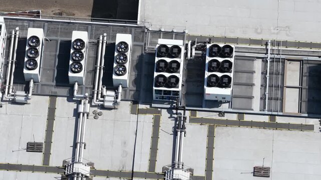 erial view of large scale data center rooftop HVAC cooling systems, showing colocation infrastructure, cloud computing, big data, machine learning and AI hardware technology.