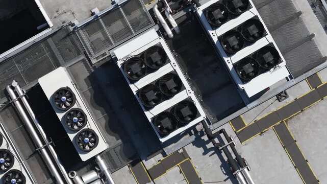 erial view of large scale data center rooftop HVAC cooling systems, showing colocation infrastructure, cloud computing, big data, machine learning and AI hardware technology.