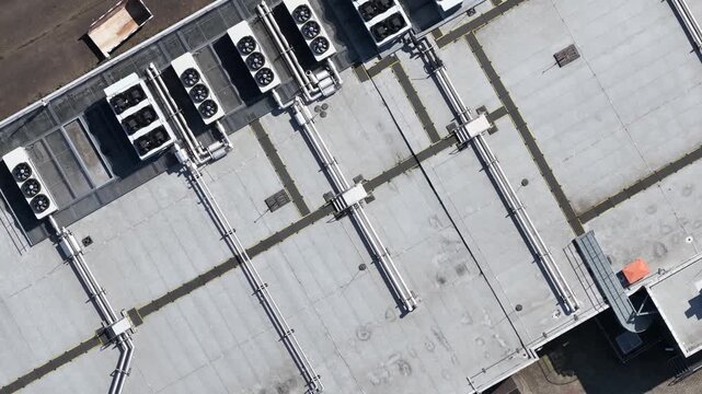 erial view of large scale data center rooftop HVAC cooling systems, showing colocation infrastructure, cloud computing, big data, machine learning and AI hardware technology.