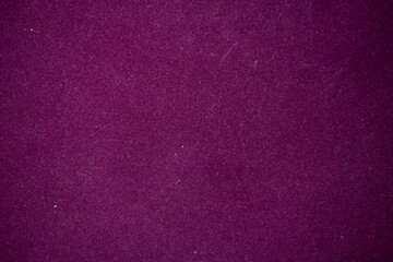 Fototapeta premium Purple velvet fabric texture creating a soft, luxurious background, showing rich, deep magenta and royal violet hues