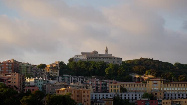 Aerial Dolly in Genoa Italy Hillside Buildings and Santuario di Nostra Signora Loreto Golden Hour