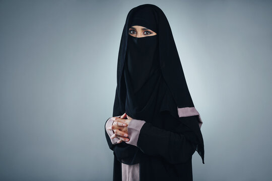 Muslim, portrait or woman in studio with burka, praise or religious practice during Ramadan. Islam, space or Arab person on gray background with faith, tradition or connection on Eid Mubarak.