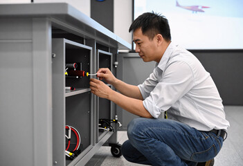 Fototapeta premium Aircraft Flight Simulator Technician at Work
