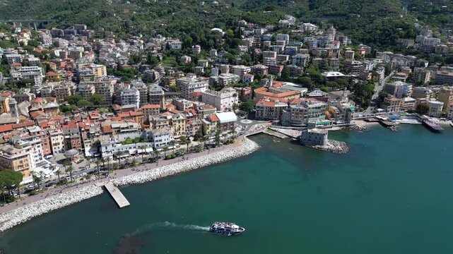 Italy, Genoa - Rapallo is a city on the eastern Liguria Riviera with a bay and a port for boats - a tourist attraction near Portfino and the Cinque Terre - - ferry boat for tourist 
