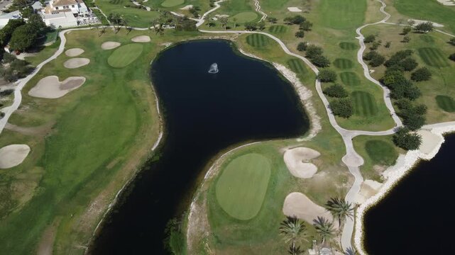 Aerial view of the water reservoirs of the Font del Llop golf course. Monforte del Cid, Spain.