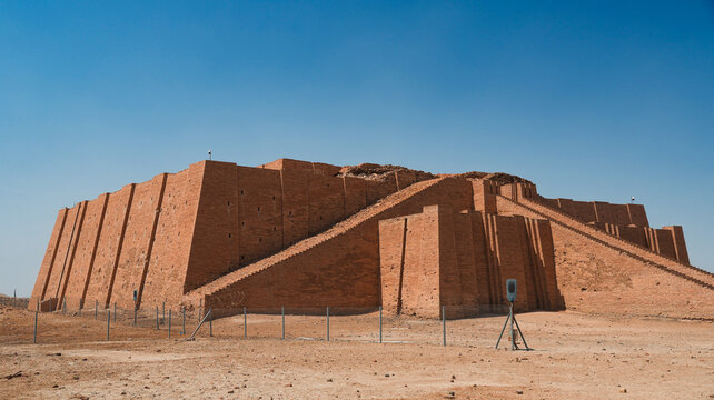 Exploring the ancient Ziggurat of Ur in Iraq under clear blue skies