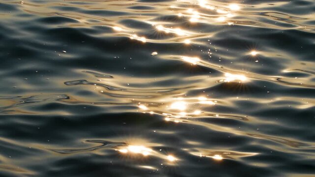 Sunstar reflections sparkling on sea water