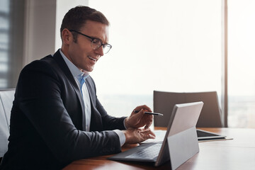 Laptop, paperwork and business man in office for research, stock trading and finance report. Corporate, financial advisor and person with computer for investor career, planning and budget review © peopleimages.com