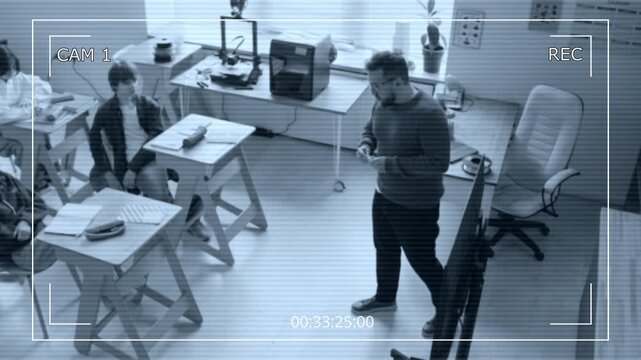 CAM view of teacher holding printed part, explaining structure to students, demonstrating object during lesson