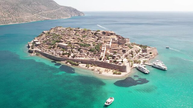 Aerial panoramic view of Spinalonga fortress island and turquoise sea