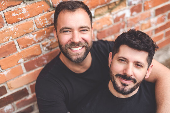A Portrait of a happy gay couple outdoors in urban background