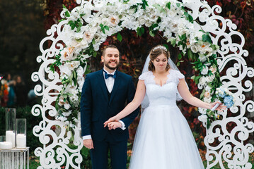 wedding ceremony of the newlyweds on the glade © omelnickiy