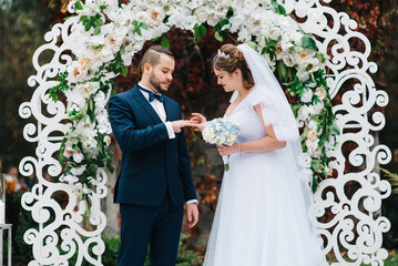 wedding ceremony of the newlyweds on the glade © omelnickiy