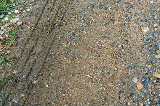 Tire Tracks on Gravel and Dirt Path