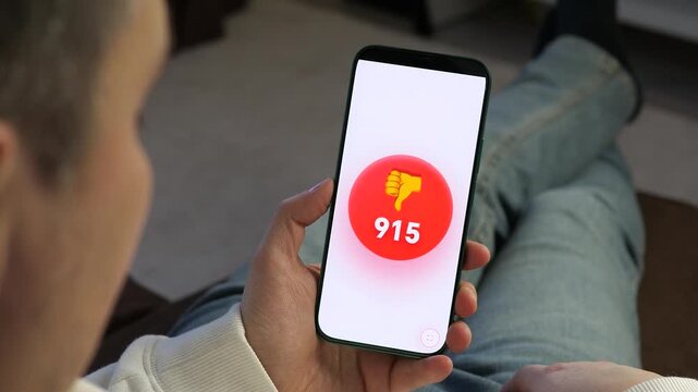 Close-up of a mobile app showing a surge of negative engagement. The dislike button counter rapidly increases, representing viral criticism. Ideal for videos on online reputation, marketing failures