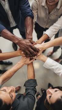 Diverse hands together team unity