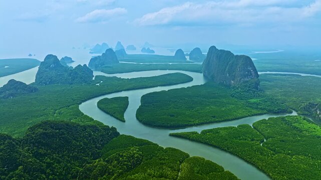  Aerial hyper lapse panorama showcasing the natural beauty of Phang Nga Bay with heart shaped mangrove islands and calm seawater reflections. sweet Sunrise Above Baan Nai Ngob Mangroves